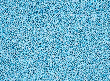 cropped-stock-photo-pattern-blue-urea-fertiliser-can-use-for-background-447307228.jpg