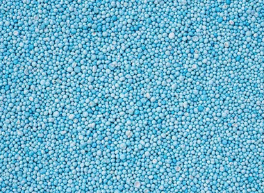 cropped-stock-photo-pattern-blue-urea-fertiliser-can-use-for-background-447307228.jpg